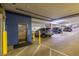 Well-lit parking garage with car elevator and assigned parking spaces for resident convenience at 355 E Ohio St # 221, Indianapolis, IN 46204
