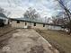 Backyard features a concrete driveway leading to the rear entrance of the house at 3812 S Ebright St, Muncie, IN 47302