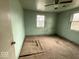 Bedroom showcasing painted walls, carpeted flooring, and natural light at 3812 S Ebright St, Muncie, IN 47302