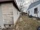 Exterior view of the house showing the space between the house and the siding at 3812 S Ebright St, Muncie, IN 47302