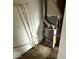 Image shows the furnace with metal piping in a utility area at 3812 S Ebright St, Muncie, IN 47302