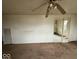 View of the living room showing carpet and a ceiling fan at 3812 S Ebright St, Muncie, IN 47302