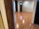 Spacious living room features warm wood flooring, neutral walls, and good natural light at 3817 N Sheridan Ave, Indianapolis, IN 46226