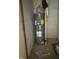 Tight storage area featuring a hot water heater at 3817 N Sheridan Ave, Indianapolis, IN 46226