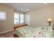 Bedroom featuring neutral walls, a bed with floral accents, a bedside table, and bright windows at 3941 Stratfield Way, Westfield, IN 46074