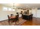 Modern kitchen with stainless steel appliances, an island, and an adjacent dining area at 3941 Stratfield Way, Westfield, IN 46074