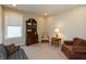 Cozy living room with lots of natural light, featuring hardwood floors, comfortable seating, and a writing desk at 3941 Stratfield Way, Westfield, IN 46074