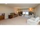 Spacious living room featuring neutral walls, carpet, bookshelves, and comfortable seating perfect for relaxation at 3941 Stratfield Way, Westfield, IN 46074