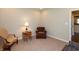 Cozy living room with neutral-colored walls, comfortable seating, and a side table with lamp at 3941 Stratfield Way, Westfield, IN 46074