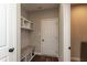 Mudroom entry featuring built-in bench with storage, coat hooks, and a convenient doorway at 3941 Stratfield Way, Westfield, IN 46074