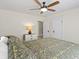 Cozy bedroom with hardwood floors, a lamp, and a ceiling fan for comfort at 3960 N Park Ave, Indianapolis, IN 46205
