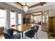 Dining room features wood trim, chandelier, and French doors leading to living room at 3960 N Park Ave, Indianapolis, IN 46205