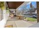 Charming covered front porch with brick accents, perfect for enjoying the outdoors at 3960 N Park Ave, Indianapolis, IN 46205
