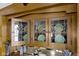 Close-up of built-in hutch with leaded glass doors and decorative plates at 3960 N Park Ave, Indianapolis, IN 46205