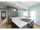 Gourmet kitchen showcasing a large island, gas range, and modern finishes at 3960 N Park Ave, Indianapolis, IN 46205