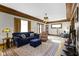 Spacious living room with hardwood floors, fireplace, detailed ceilings and vintage lighting at 3960 N Park Ave, Indianapolis, IN 46205