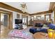 Inviting living room featuring a brick fireplace, beautiful wood trim, and a stylish chandelier at 3960 N Park Ave, Indianapolis, IN 46205