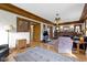 Living room with hardwood floors, a fireplace, and doorways to other rooms at 3960 N Park Ave, Indianapolis, IN 46205