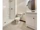 Bathroom featuring a modern vanity, a toilet, tiled flooring, and a walk-in shower with a white surround at 5099 Nicodemus Dr, Plainfield, IN 46168