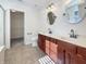 Bathroom with dual sinks, wood cabinets, and a separate shower at 5099 Nicodemus Dr, Plainfield, IN 46168