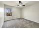 Bright bedroom with gray carpet and a sunlit window featuring outside view at 5099 Nicodemus Dr, Plainfield, IN 46168