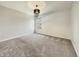 A minimalist bedroom featuring neutral walls, plush carpeting, a window and stylish hanging light fixture at 5099 Nicodemus Dr, Plainfield, IN 46168