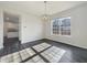 Dining room features hardwood flooring, natural light, and elegant chandelier at 5099 Nicodemus Dr, Plainfield, IN 46168