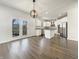 Spacious white kitchen featuring stainless steel appliances and hardwood flooring at 5099 Nicodemus Dr, Plainfield, IN 46168