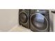Laundry area with a side-by-side washer and dryer for convenient clothes washing at 5099 Nicodemus Dr, Plainfield, IN 46168