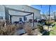 The cozy backyard patio is shaded by a pergola for outdoor enjoyment at 5941 Bonneville Way, Indianapolis, IN 46237