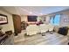 Finished basement with home theater seating, vinyl floors, and large screen TV at 5941 Bonneville Way, Indianapolis, IN 46237