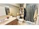 Bathroom featuring tiled floors, shelving, and a shower with curtain at 5941 Bonneville Way, Indianapolis, IN 46237