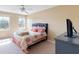 Neutral bedroom featuring one window, plush carpet, and a ceiling fan at 5941 Bonneville Way, Indianapolis, IN 46237