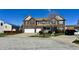 Lovely brick home with well-kept landscaping and three-car garage at 5941 Bonneville Way, Indianapolis, IN 46237