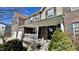 Welcoming front porch with brick accents, a cozy seating area, and a charming welcome sign on the door at 5941 Bonneville Way, Indianapolis, IN 46237