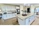 Spacious kitchen with a large central island, granite countertops and stainless steel appliances at 5941 Bonneville Way, Indianapolis, IN 46237