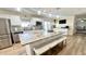This spacious kitchen features a large center island with seating and modern stainless steel appliances at 5941 Bonneville Way, Indianapolis, IN 46237