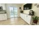 Kitchen featuring a built-in coffee bar, backyard access, and modern appliances at 5941 Bonneville Way, Indianapolis, IN 46237