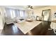 Spacious living room featuring a large sectional sofa, area rug, and neutral decor at 5941 Bonneville Way, Indianapolis, IN 46237