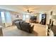 Large living room featuring an entertainment center, comfortable seating, neutral colors and lots of light at 5941 Bonneville Way, Indianapolis, IN 46237