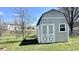 A backyard storage shed with double doors for easy access at 5941 Bonneville Way, Indianapolis, IN 46237