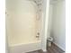 Bathroom featuring a shower/tub combo with modern fixtures and a white surround at 6191 E Ayrshire Cir, Camby, IN 46113