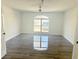 Bright bedroom with a ceiling fan, large window, and ample natural light at 6191 E Ayrshire Cir, Camby, IN 46113