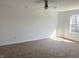 Bedroom featuring plush carpet, neutral walls, and natural light from a bright window at 6191 E Ayrshire Cir, Camby, IN 46113