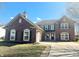 Charming two-story home with a two-car garage, brick accents, and a landscaped front yard at 6191 E Ayrshire Cir, Camby, IN 46113