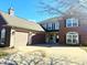 Elegant home showcasing a two-car garage and a driveway with brick and concrete finishes at 6191 E Ayrshire Cir, Camby, IN 46113