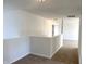 Upstairs hallway featuring carpet and neutral walls at 6191 E Ayrshire Cir, Camby, IN 46113