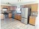 Well-equipped kitchen featuring stainless steel appliances, mosaic backsplash, and ample cabinet space at 6191 E Ayrshire Cir, Camby, IN 46113
