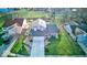 Overhead view of a well-maintained home with a spacious front lawn, long driveway, and mature trees at 628 Southridge Ct, Westfield, IN 46074