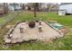 Backyard features a cozy fire pit area and lush green grass at 628 Southridge Ct, Westfield, IN 46074